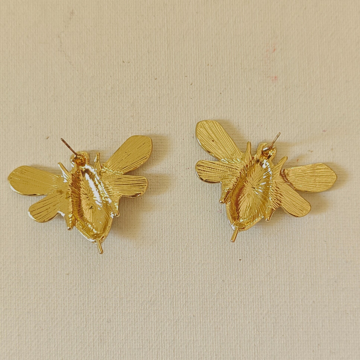 Honeybee on a runway statement studs