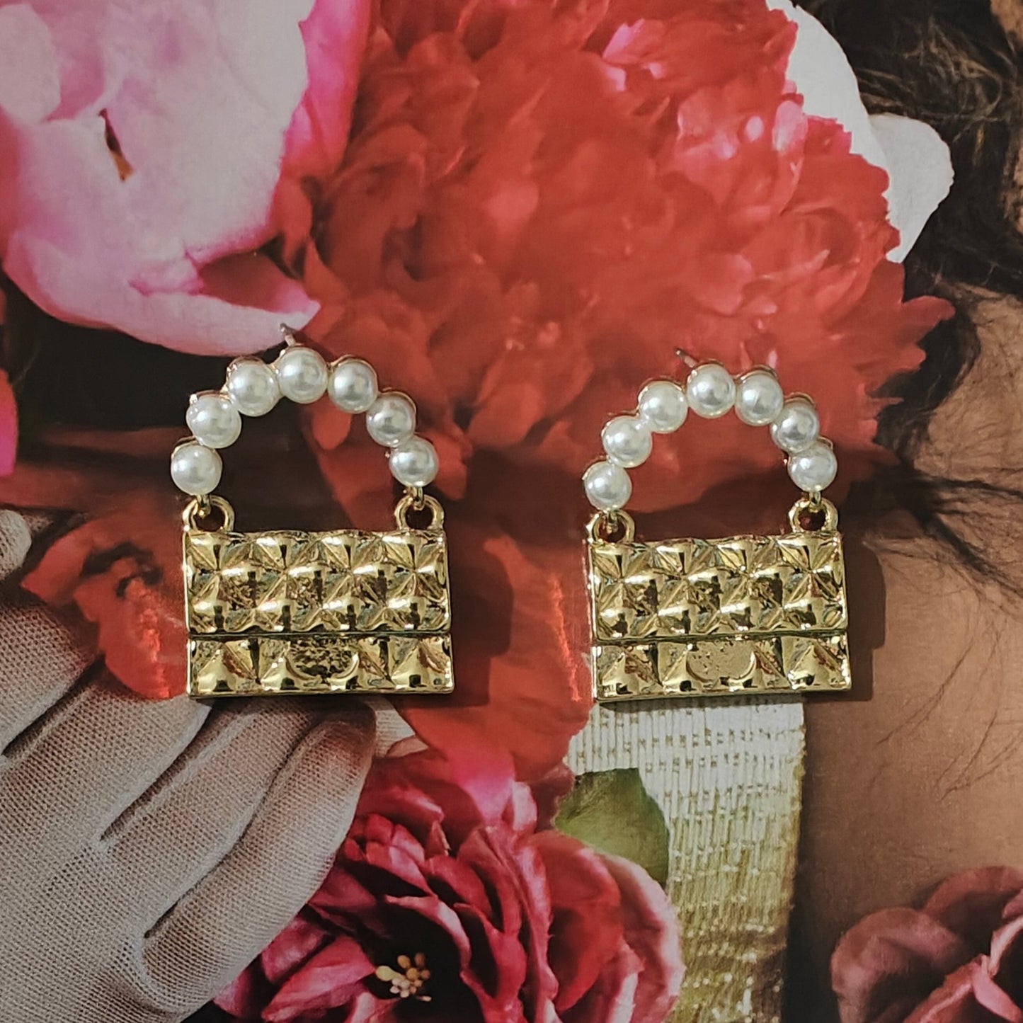 Golden bag earrings.
(Only meant to carry feelings)