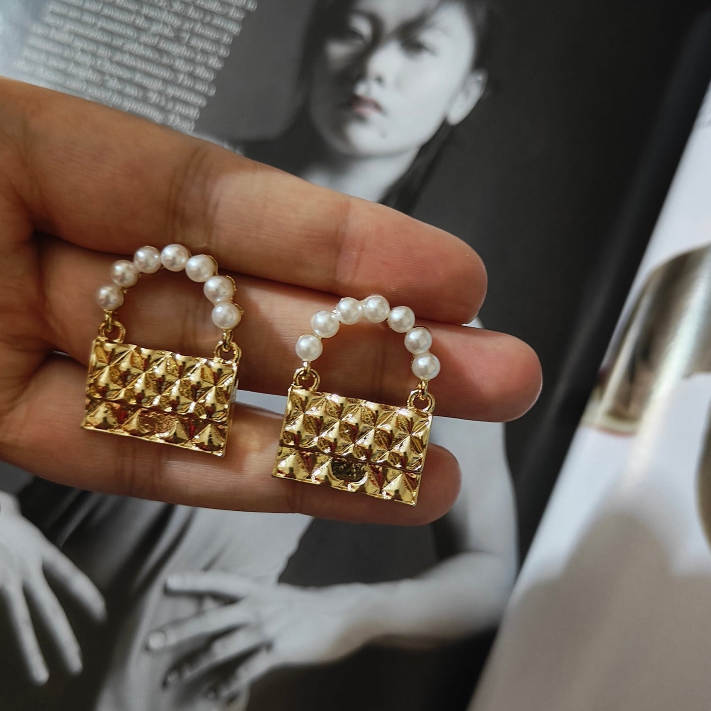 Golden bag earrings.
(Only meant to carry feelings)